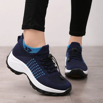 Women's lightweight sneakers shown with size guide chart