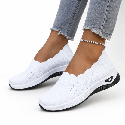 Pair of Breza women's sneakers in brown displayed on clean background
