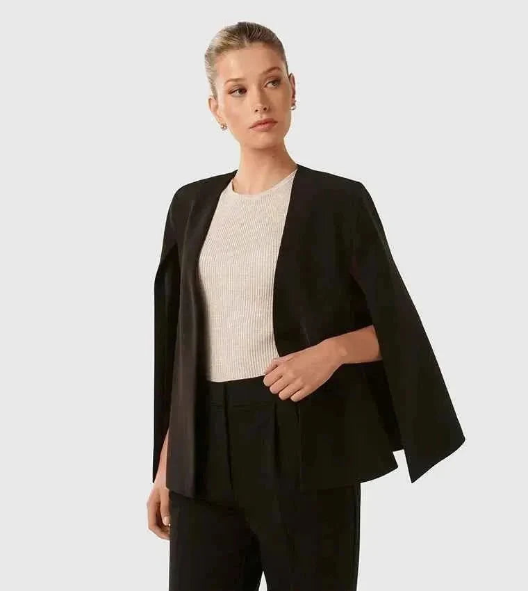 Close-up of cape blazer slit sleeve detail and clean shoulder seam