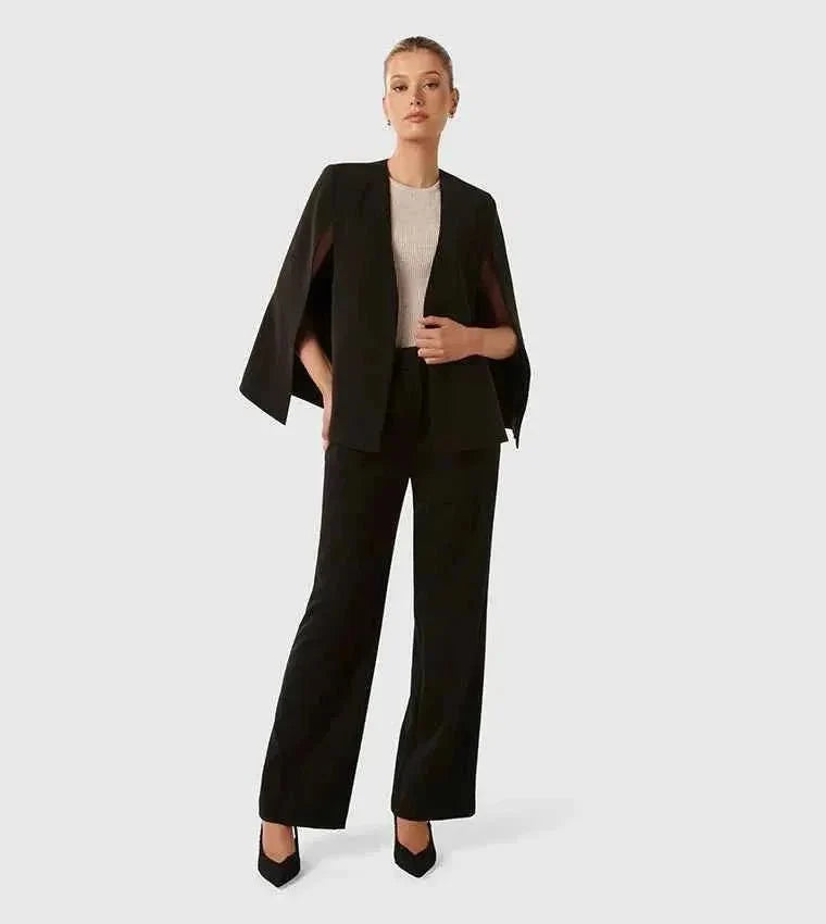 White and black women's cape blazers side by side on model