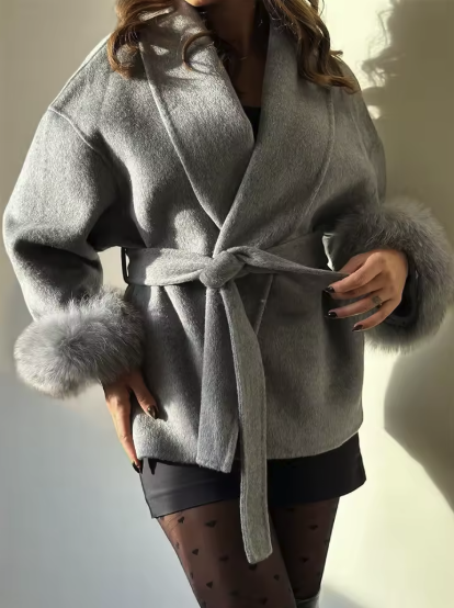 Detail shot of fox fur cuff trim on Celeste short wool coat in white