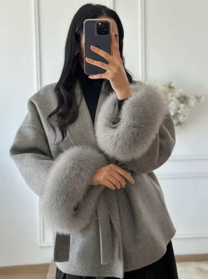 Close-up of fox fur trim on collar and cuffs of Celeste wool coat