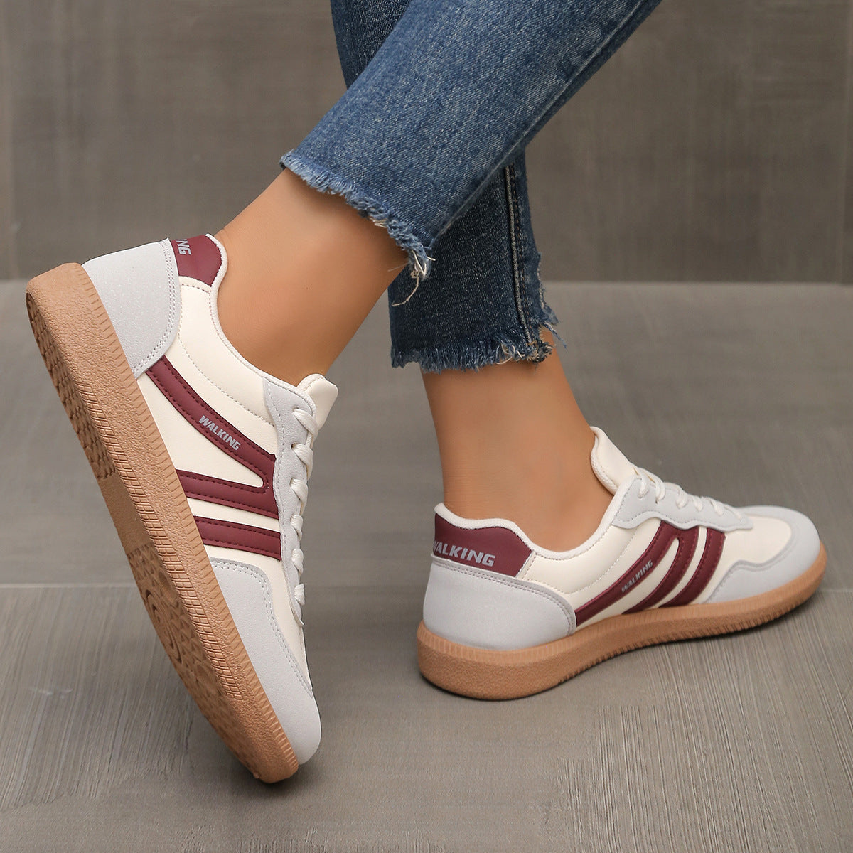 Cleo off-white trainers from the front showing wide toe box design