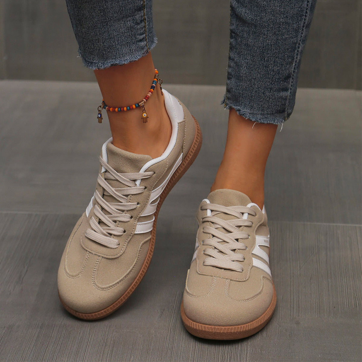 Pair of Cleo khaki orthopedic trainers on a neutral background