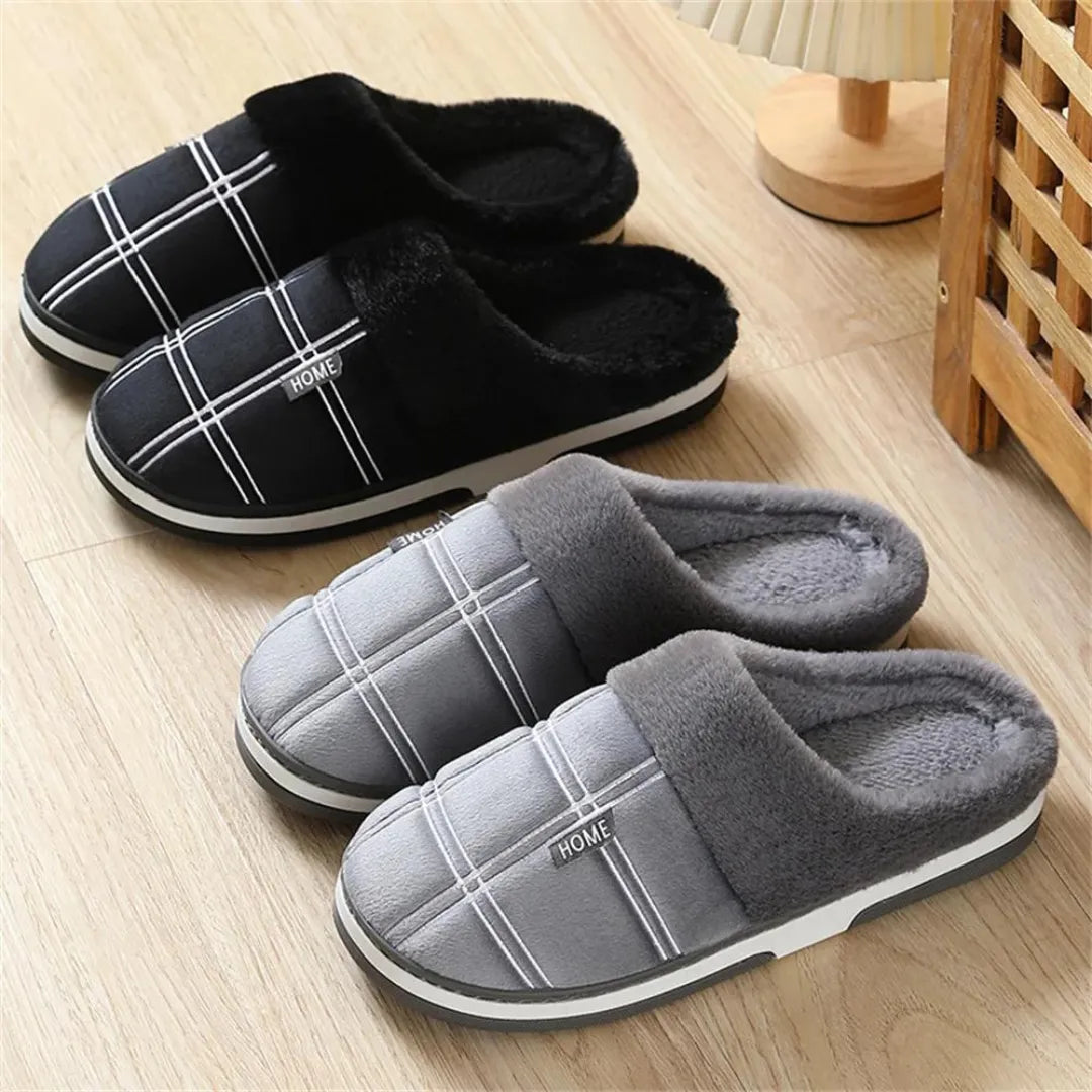 Cozy black plush slippers from rear angle showing heel and sole