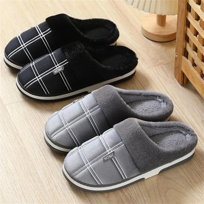 Cozy black plush slippers from rear angle showing heel and sole