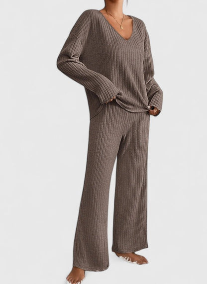 Women's grey knit lounge set featuring ribbed wide-leg trousers and soft sweater