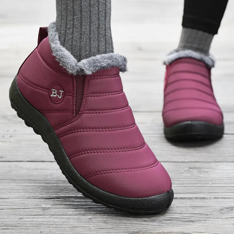 Black waterproof slip-on winter boots with faux-fur lining