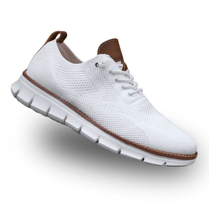 Jayden walkers in white on a flat surface, top-down view
