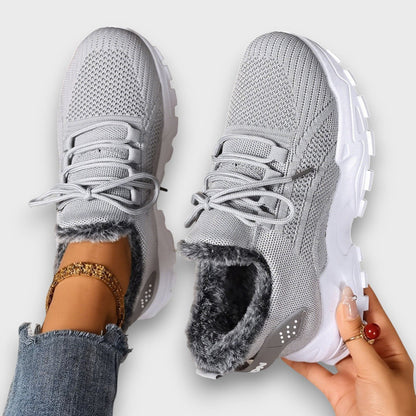 Close-up of Kayla sneaker lace-up closure and soft faux fur inner lining