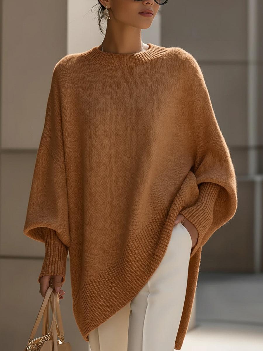 Close-up of ribbed cuffs and hem detail on the Liora oversized knit poncho
