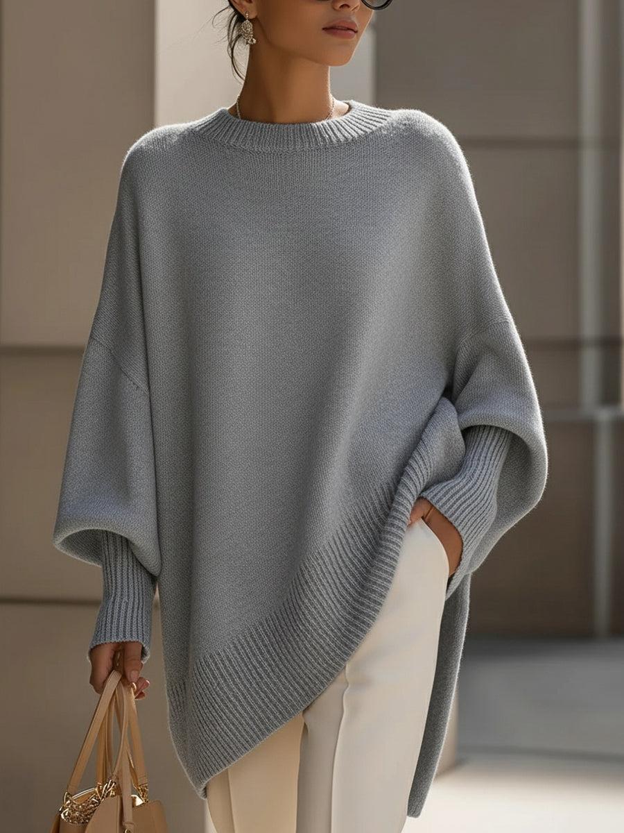 Liora oversized poncho in caramel paired with tailored trousers for a chic layered look
