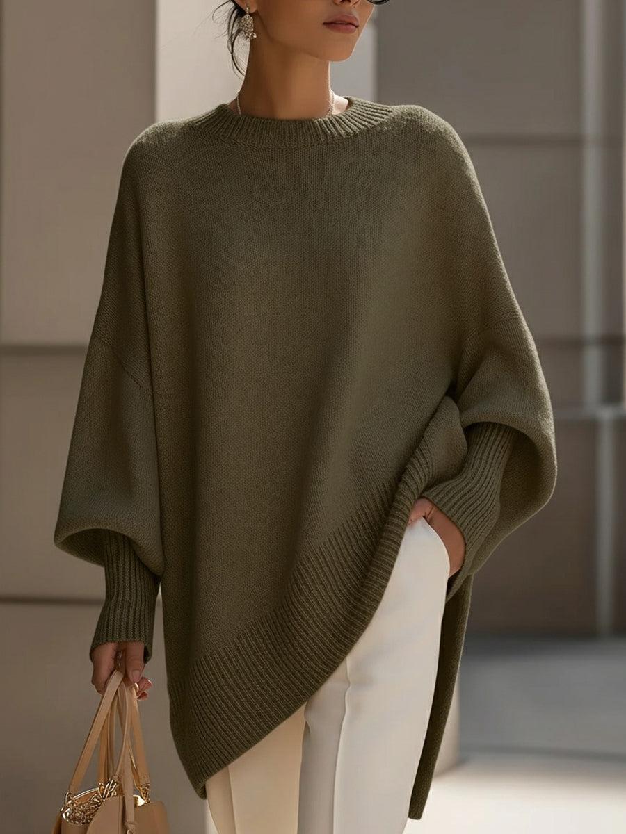 Liora knit poncho in gray styled with denim for a casual everyday outfit