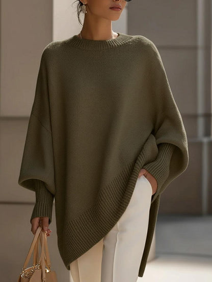 Liora knit poncho in gray styled with denim for a casual everyday outfit