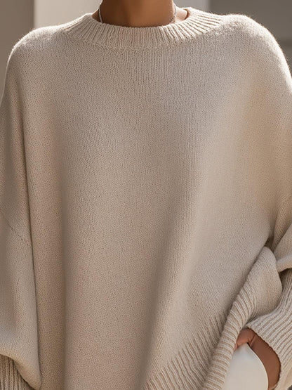 Back view of Liora oversized poncho in pink showing fluid drape and batwing sleeve shape