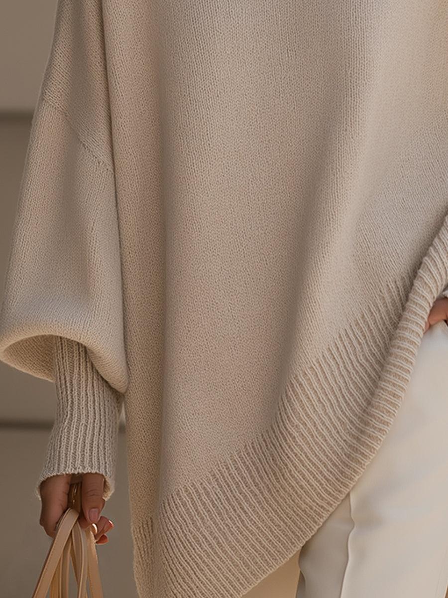 Liora oversized knit poncho in multiple colors displayed side by side — beige, black, navy blue and caramel