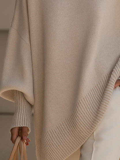 Liora oversized knit poncho in multiple colors displayed side by side — beige, black, navy blue and caramel