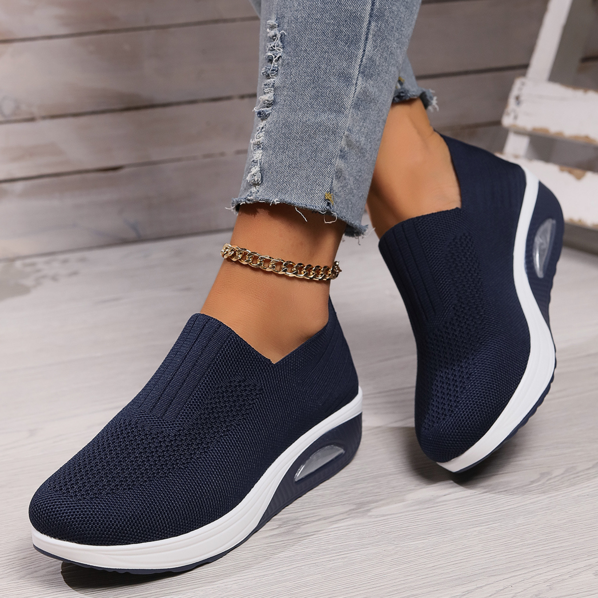 Lyra slip-on sneakers in black with elevated cushioned sole