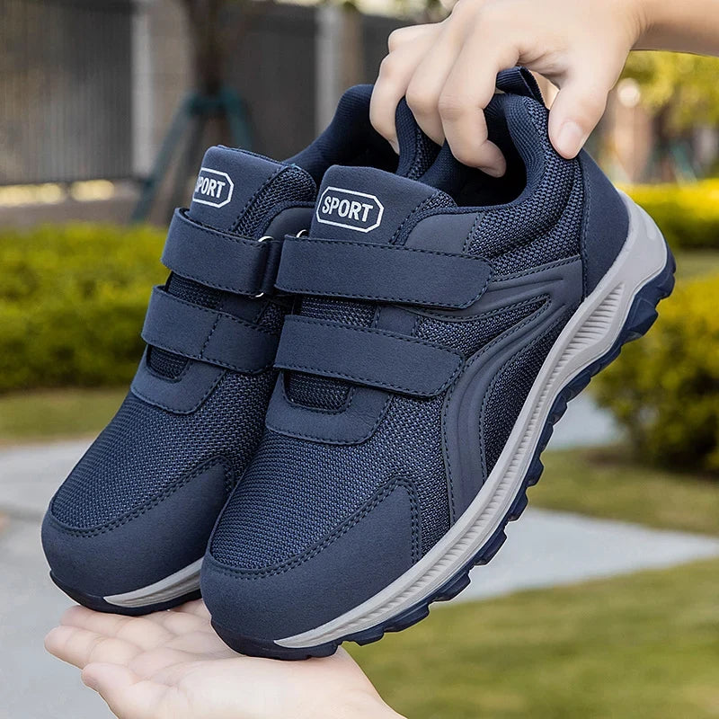 Side profile of men's low-profile orthopedic walking trainers in black