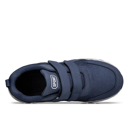 Velcro strap detail close-up on men's easy-fasten walking trainers