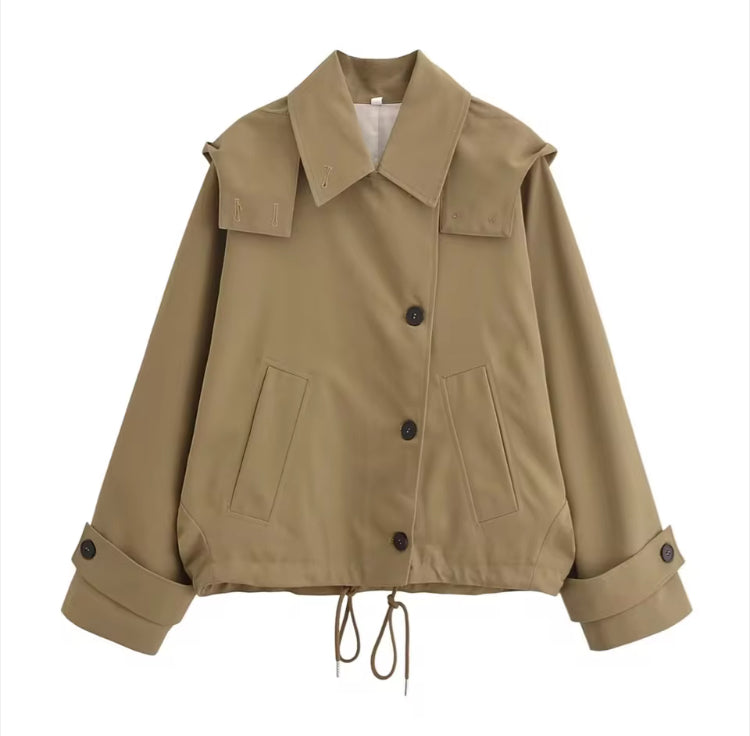 Novia women's trench coat in white, cropped silhouette full-length shot