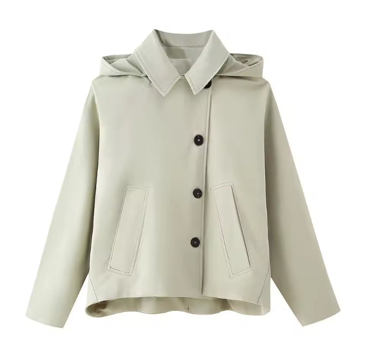 Women's autumn trench coat styled over office outfit, urban look