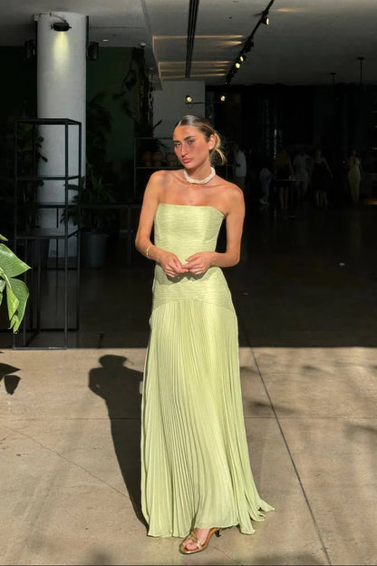 Green maxi dress pleats detail and fabric texture close-up