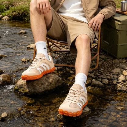 Rovik white sneakers worn outdoors on pavement, lifestyle image