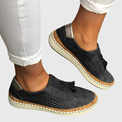Woman wearing Solace orthopedic slip-ons outdoors in summer
