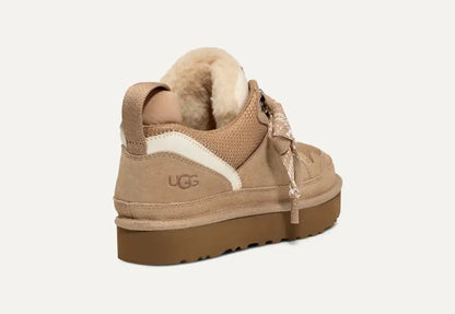 UGG Lowmel Sneaker side profile showing woven heel loop and logo patch
