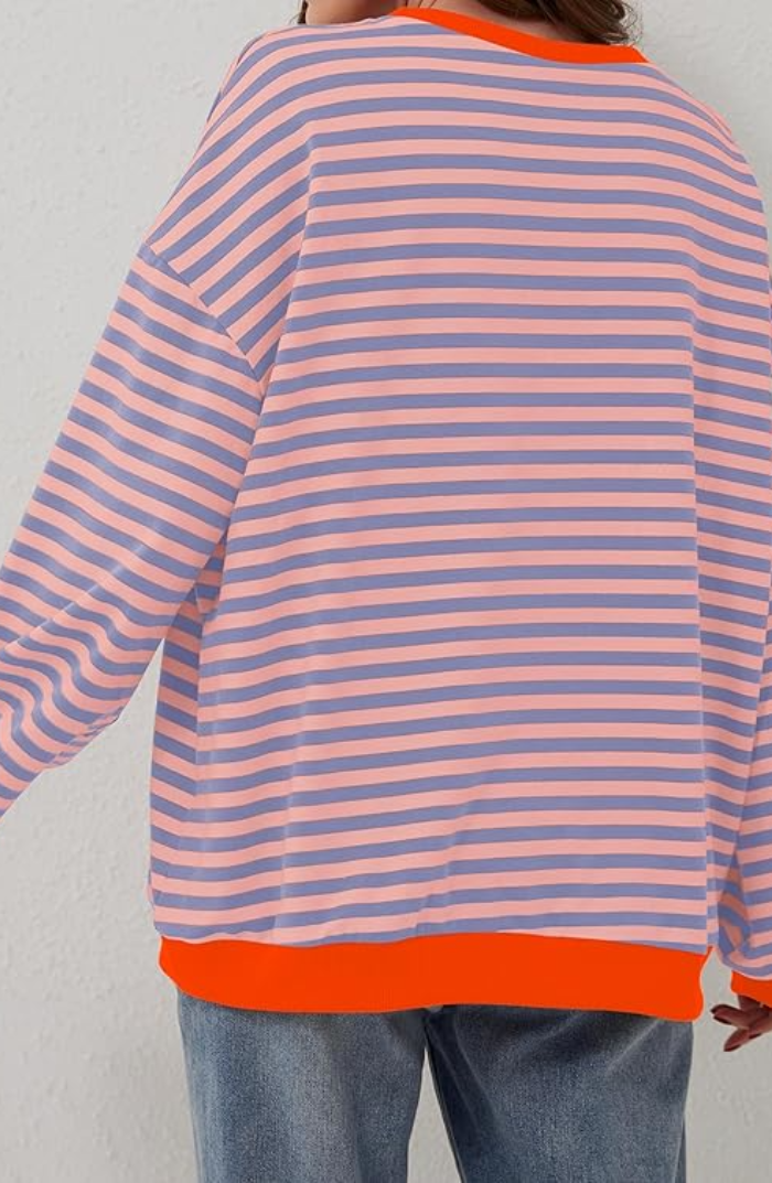 Velma casual warm sweater flat lay showing vibrant colors and texture