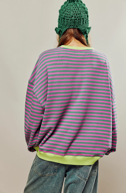 Model wearing Velma oversized knit sweater showing freedom of movement
