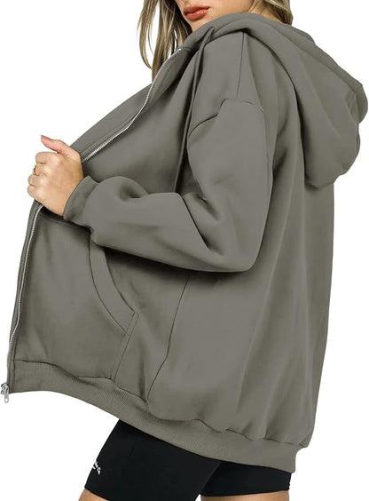 Close-up of Virelle hoodie front pockets and zip detail