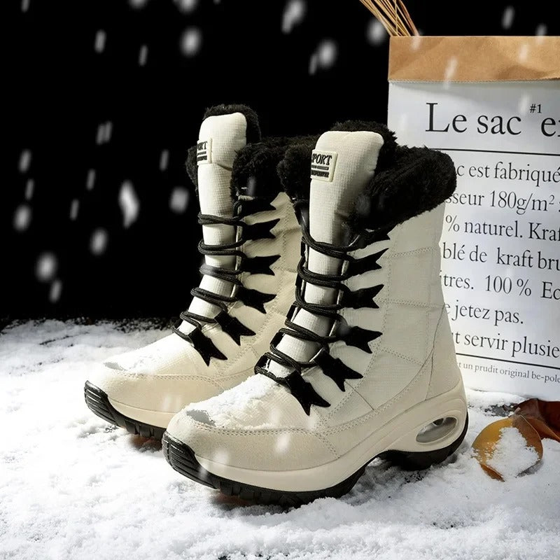 Vivara women's boots worn with jeans on a snowy surface