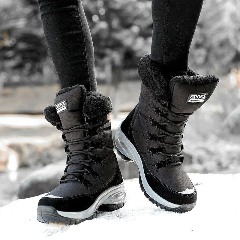 Vivara black waterproof boots on wet pavement in winter