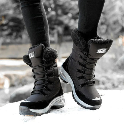 Vivara black waterproof boots on wet pavement in winter