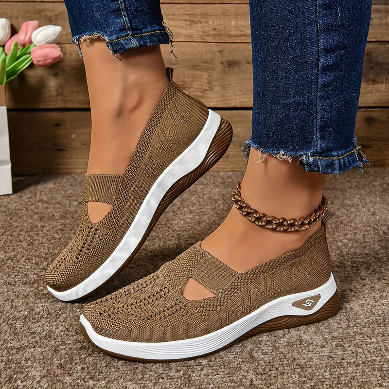 Vivienne sneakers worn by a woman in a casual everyday outfit