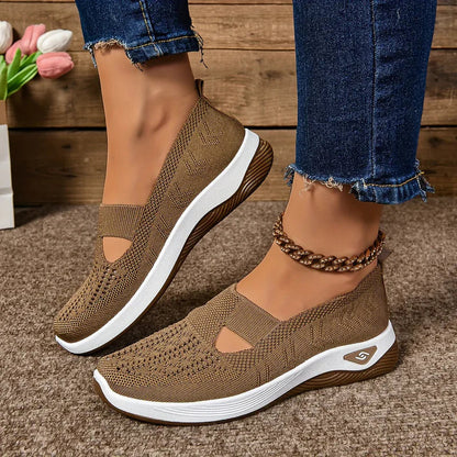 Vivienne sneakers worn by a woman in a casual everyday outfit