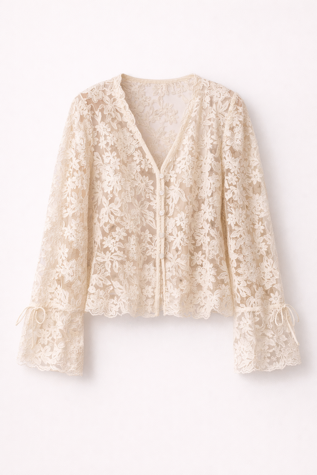 Close-up of delicate floral lace fabric on the Vivienne women's lace top in beige