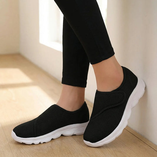 Stravio wide-fit orthopedic walking shoe in black with adjustable hook-and-loop strap