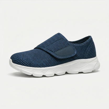 Pair of wide-fit orthopedic shoes in black displayed on neutral background