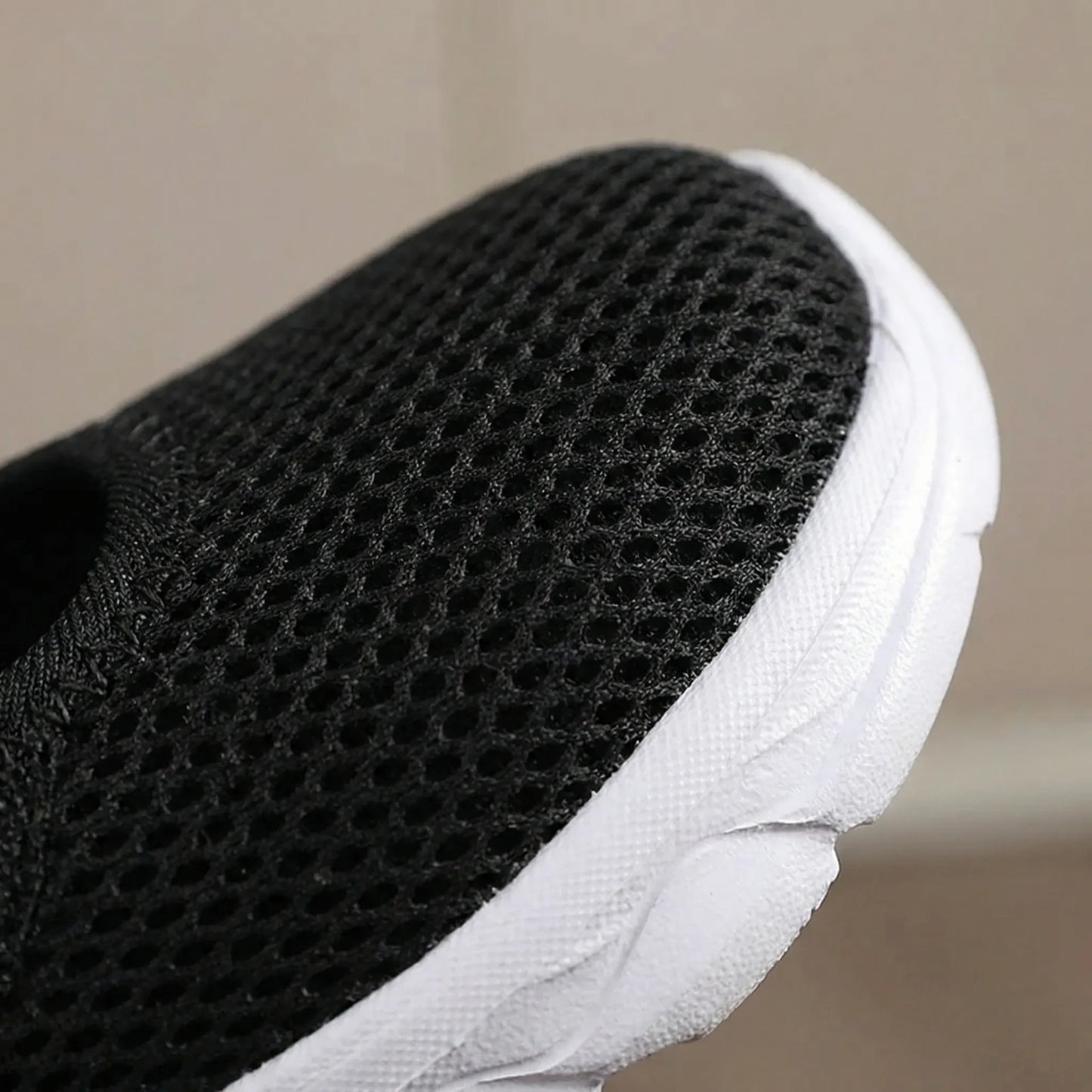 Beige wide-fit walking shoe showing breathable mesh upper construction