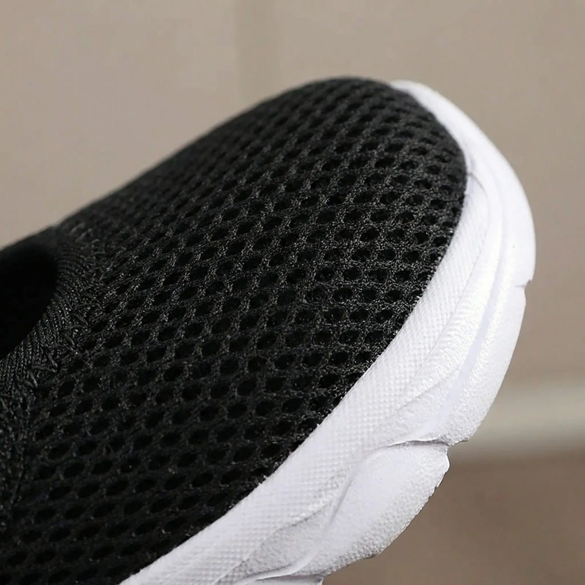 Beige wide-fit walking shoe showing breathable mesh upper construction