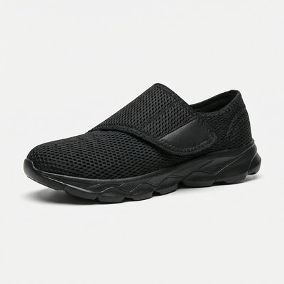 Side view of women's wide-fit walking shoe with breathable mesh upper in black