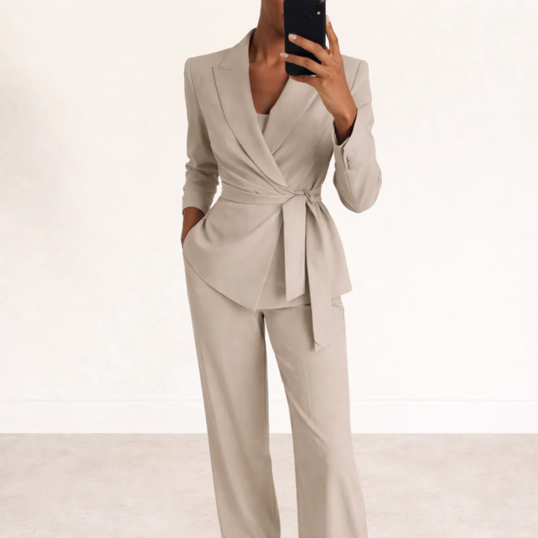 Close-up of waist belt detail on women's structured blazer set