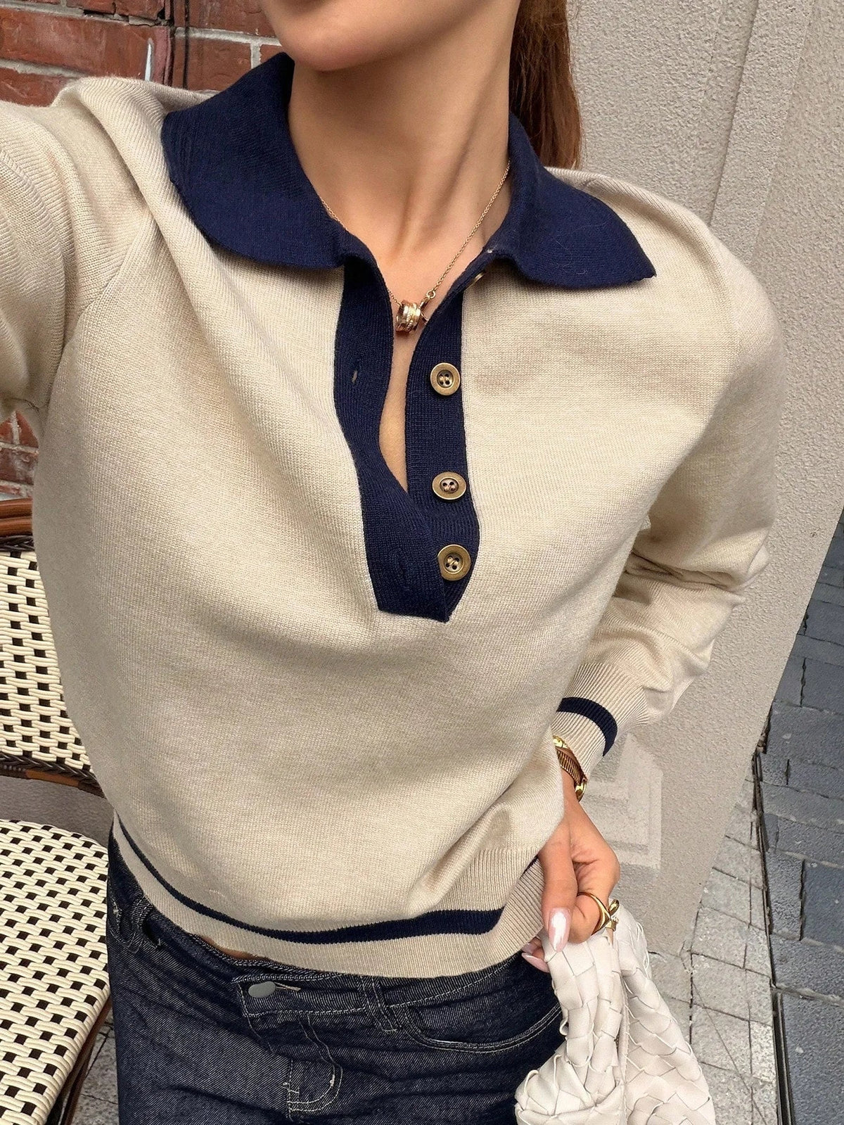 Women's autumn winter knit polo top layered under a blazer