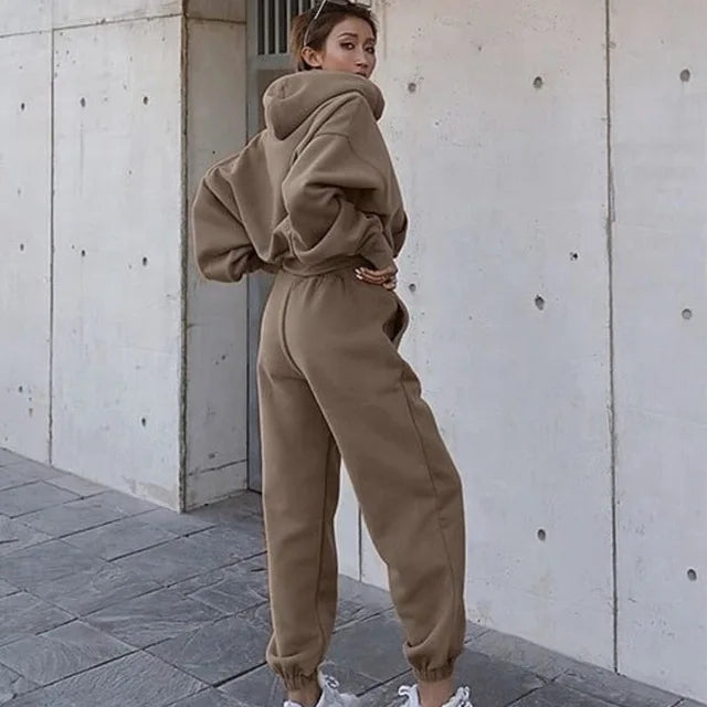Women's activewear jogging set laid flat showing hoodie and trousers