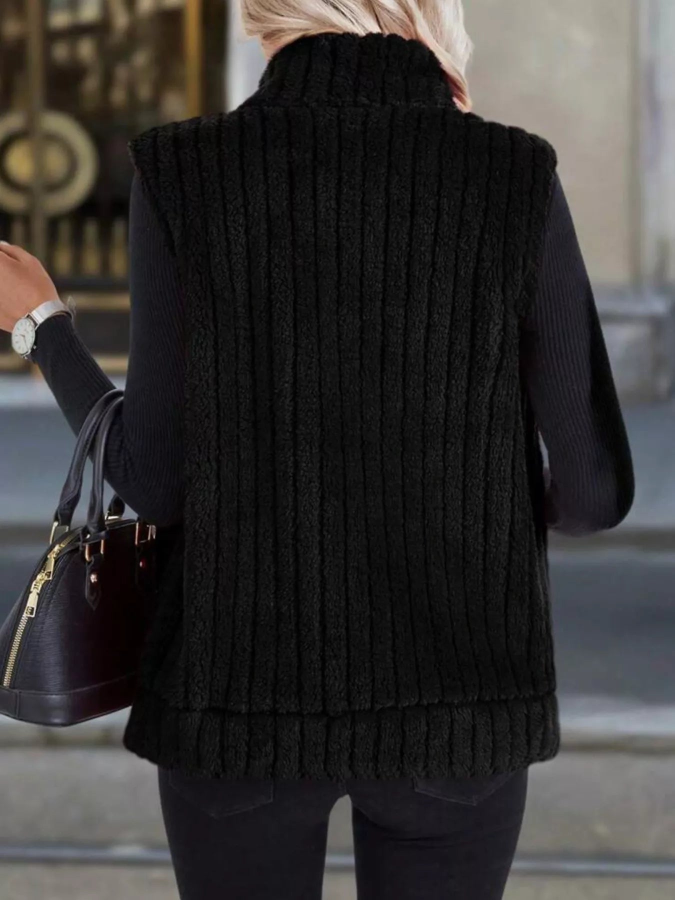 Women's brown fleece vest with zip closure and pockets