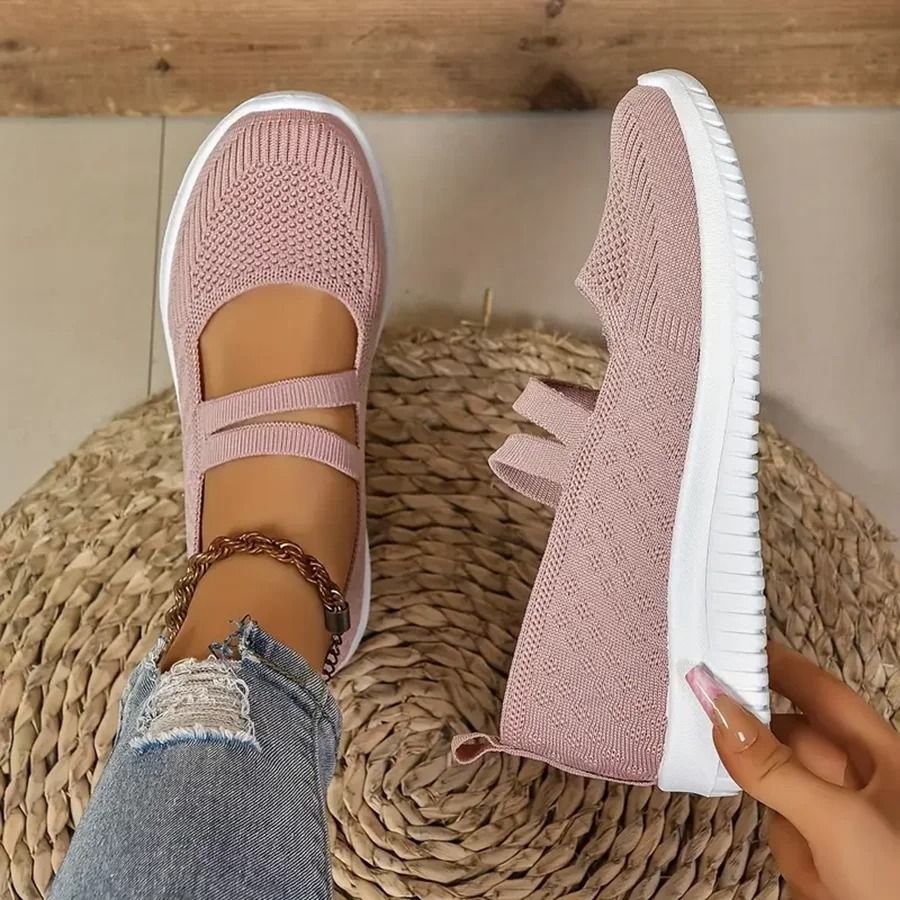 Pair of women's breathable mesh slip-on shoes shown from the back