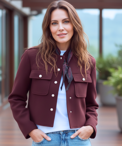 Women's military jacket in burgundy showing reinforced seam finishing
